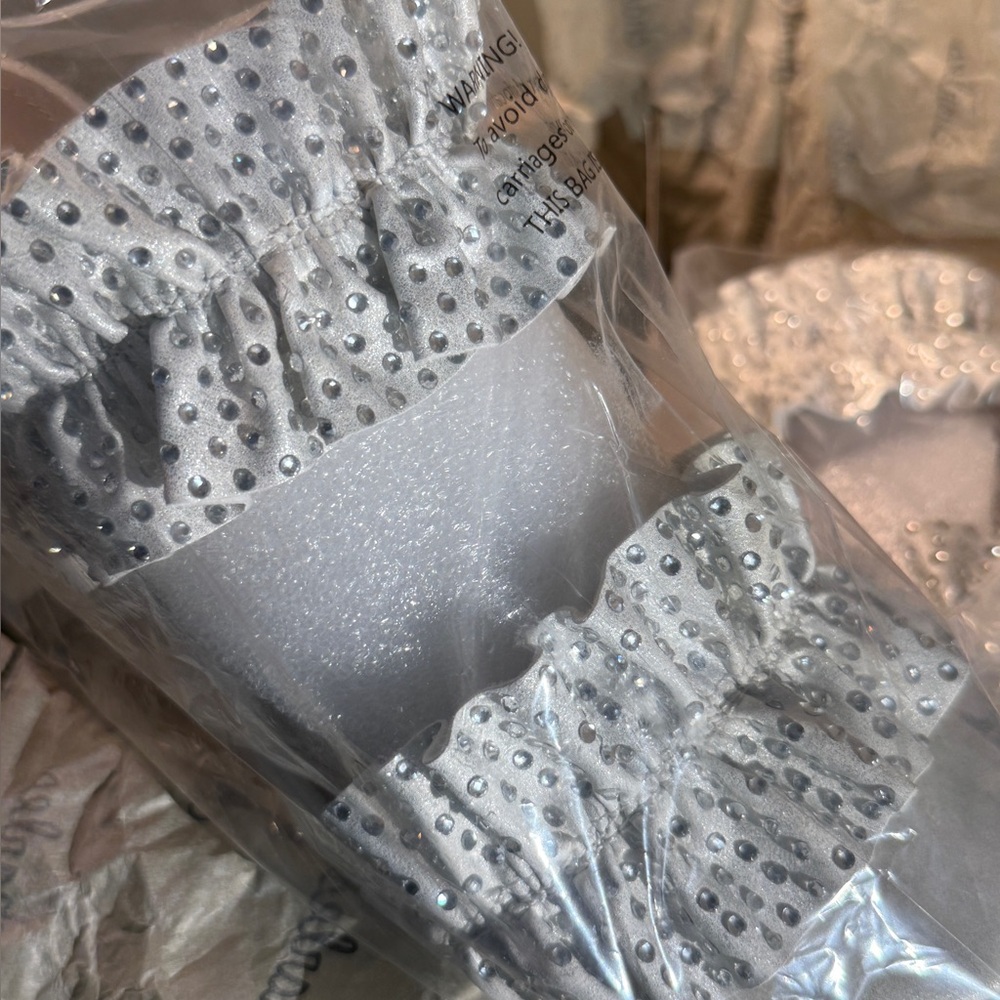 Silver and white satin high heels